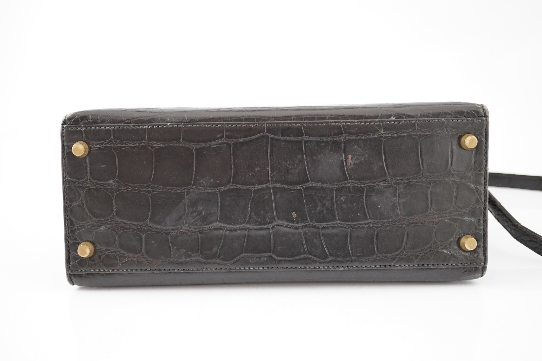 A vintage 1960's Hermès 28 Kelly in black alligator with gilt metalware, height 21cm, top of handle 31cm, width 29cm, depth 12cm
